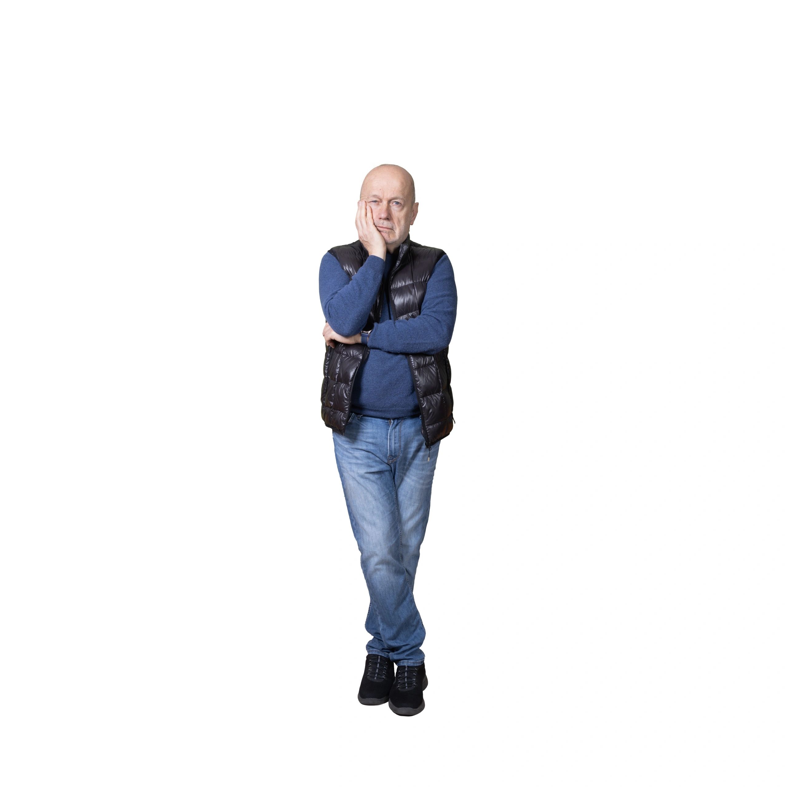 Portrait of a bald man reflecting